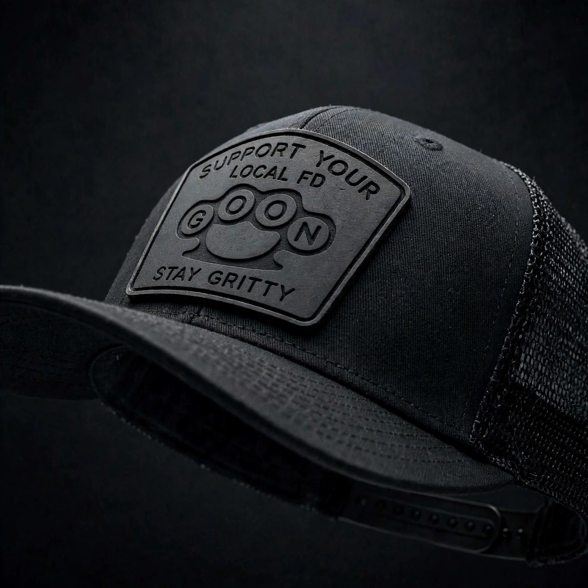 Closeup Black on black GOON Support Your Local FD Richardson 112 trucker hat , black on black murdered out silicone patch Firefighter